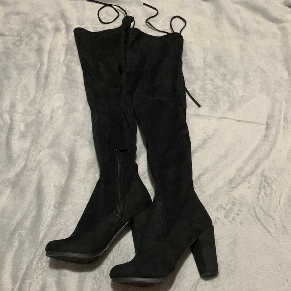 Black over the knee suede boots with adjustable drawstring.